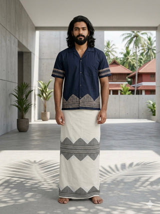 Men's Maruvam indigo geometric print cotton shirt, open camp collar, front view styled with a cream cotton mundu