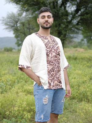 Front view of a relaxed off white cotton short kurta for men, showing the printed placket and cuffs