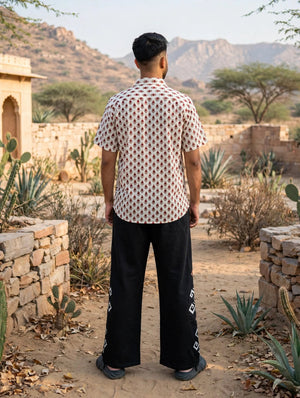 Back view of the Phool hand block print shirt, the maroon and green floral print carried across the back and sleeves
