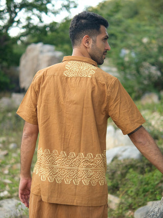Back three-quarter view of mustard yellow tribal handblock cotton shirt