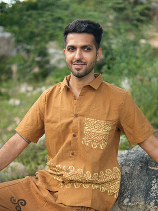 Man seated in mustard yellow tribal handblock cotton shirt, relaxed fit