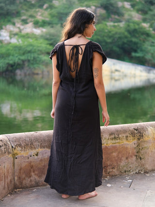 Back view of the Narmada Maxi Dress with a deep open back and adjustable drawstring tie