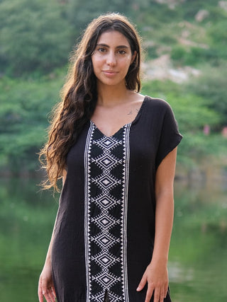 Close-up of the Narmada Maxi Dress V-neck bodice and white geometric hand block print panel