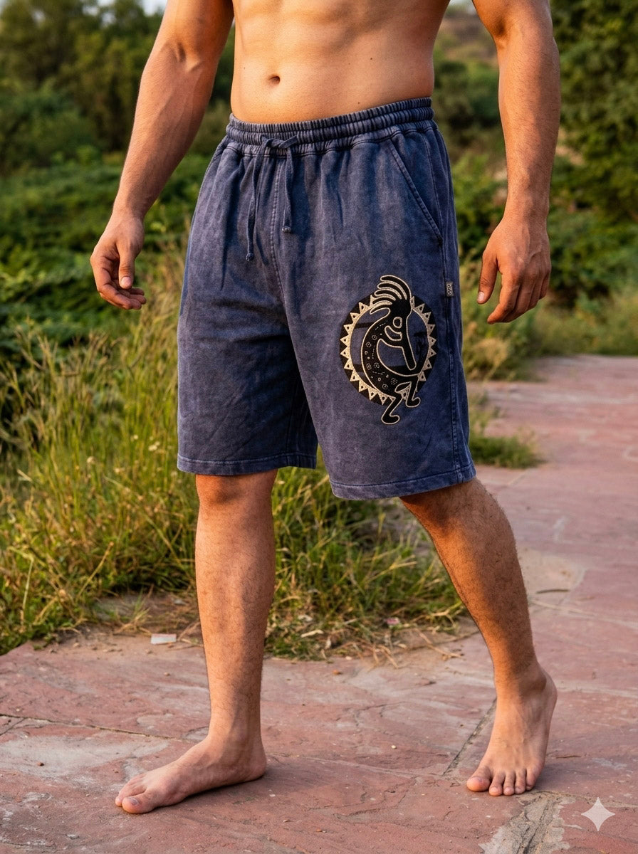 Back view of the Nimit Shorts in blue cotton, showing the elasticated waist and two patch pockets