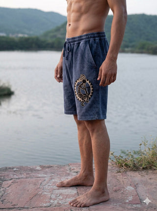 Nimit Shorts blue cotton shorts, side profile with the tie waist and handcrafted folk bird print on the leg
