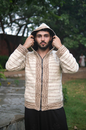 Nomad hoodie held open at the shoulders, geometric print placket, front zip and a vertical pocket slit