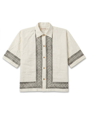 Flat-lay of the ivory Noorrekha Shirt with black chevron and dotted border print on placket and hem