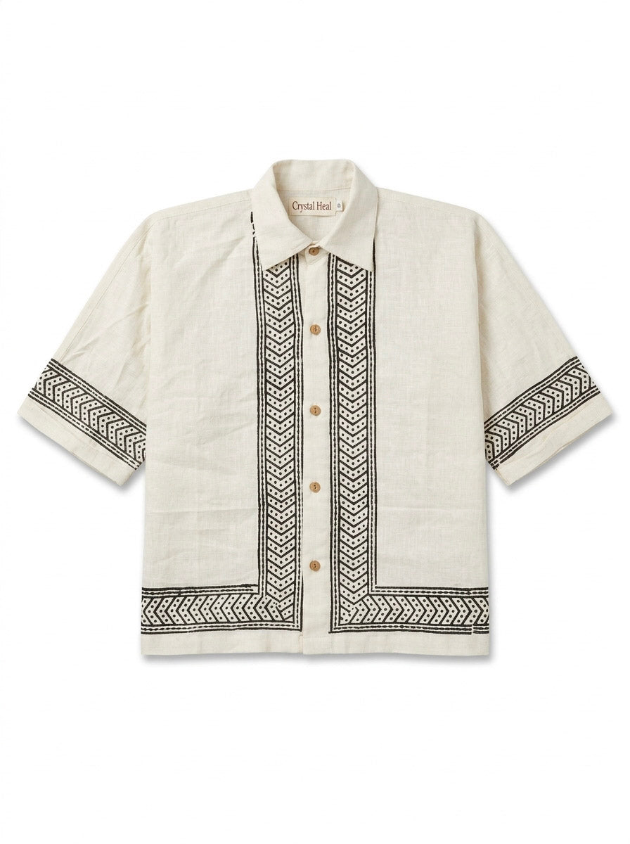 Flat-lay of the ivory Noorrekha Shirt with black chevron and dotted border print on placket and hem