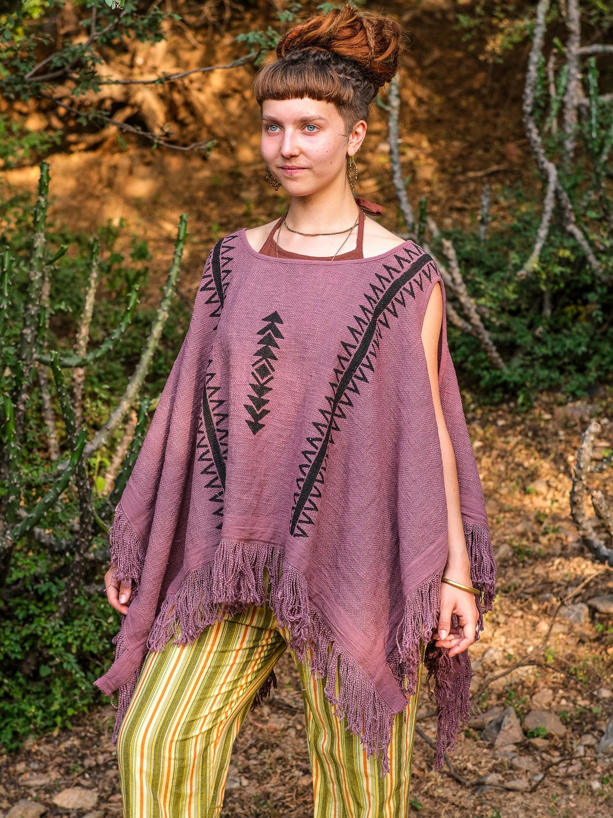 Parvati kimono in dusty mauve block print cotton with fringe trim, model standing in a relaxed pose