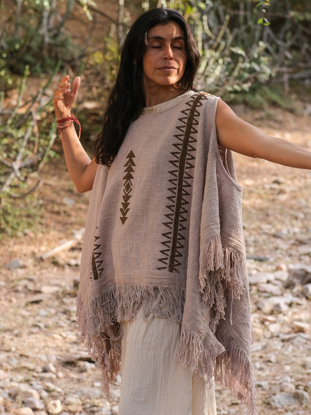 Grey-beige Parvati kimono in hand block print cotton, model with eyes closed and one arm raised