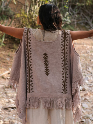 Back view of the grey-beige Parvati kimono in hand block print cotton with fringes, arms outstretched