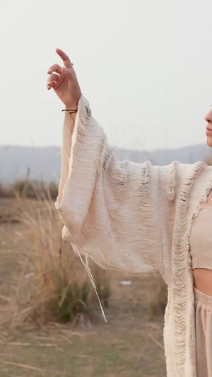Kali cotton shrug cardigan with hooded fringe detail worn by a model — video by Crystal Heal