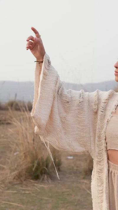Kali cotton shrug cardigan with hooded fringe detail worn by a model — video by Crystal Heal