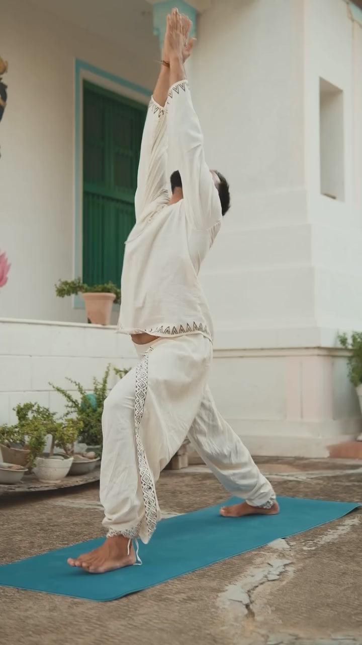 Video of the Arok Kurta in cream cotton with a lace-up neckline, shown from all sides