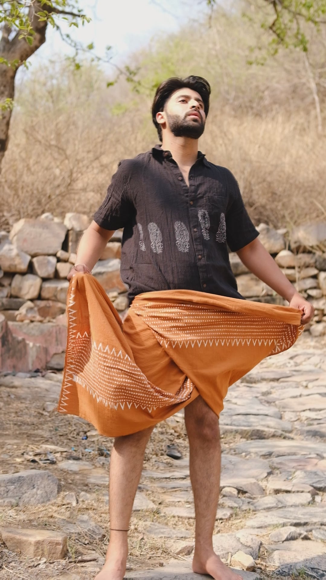 Video of the Nandan Shirt in printed cotton, shown worn and close up on the fabric