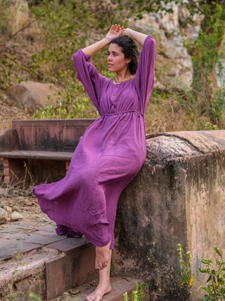 Purple rayon crepe maxi dress worn seated with arms raised