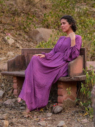 Purple rayon crepe maxi dress worn seated on a wooden bench