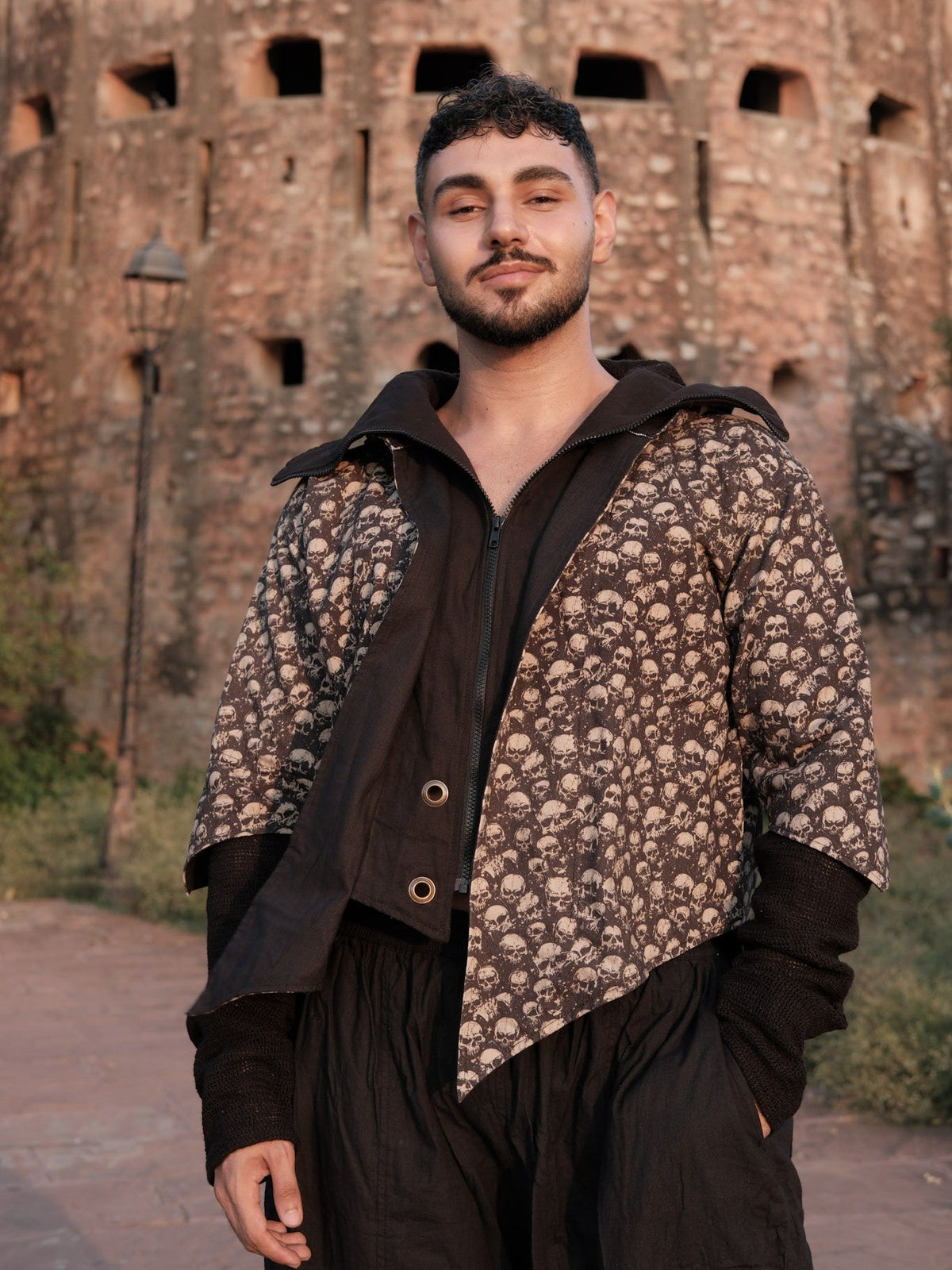 Raaz Jacket skull print hooded jacket in black cotton, front view with contrast black panel and toggles