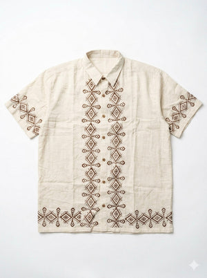 Flat-lay of the natural cream Raksha Shirt with brown geometric block print down the placket and hem