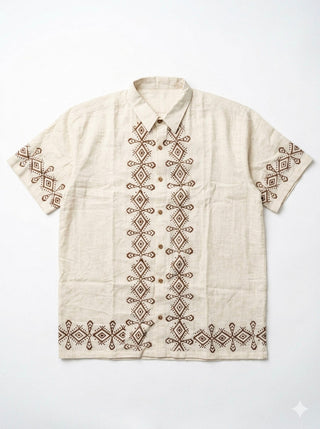 Flat-lay of the natural cream Raksha Shirt with brown geometric block print down the placket and hem