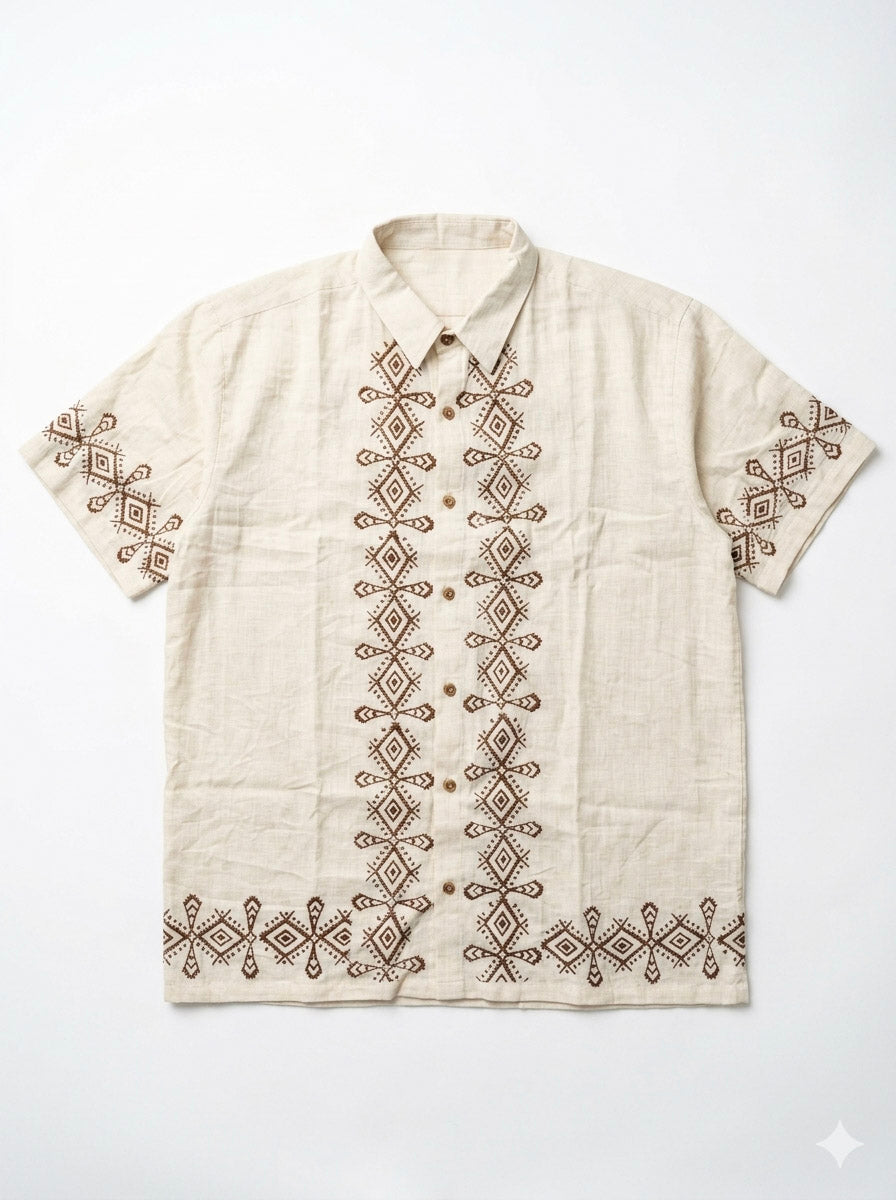 Flat-lay of the natural cream Raksha Shirt with brown geometric block print down the placket and hem