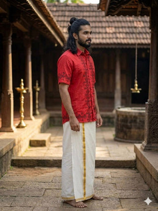 Side view of the red Raksha Shirt showing the diamond and arrow print band beside a white mundu