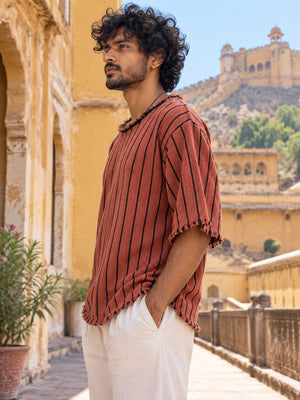 Rang Tee side view showing the wide short sleeve, frayed cuff and loose textured striped body
