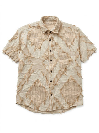 Flat lay of the Raqs beige distressed patchwork short-sleeve cotton shirt