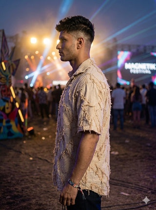 Side view of the Raqs beige patchwork cotton shirt for men at a festival