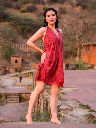 Side view of red Om print halter cotton dress showing the swishy flared hem