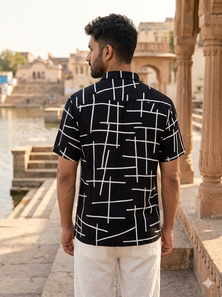 Back view of the Resh black printed cotton shirt showing the white line print running across the yoke and short sleeves