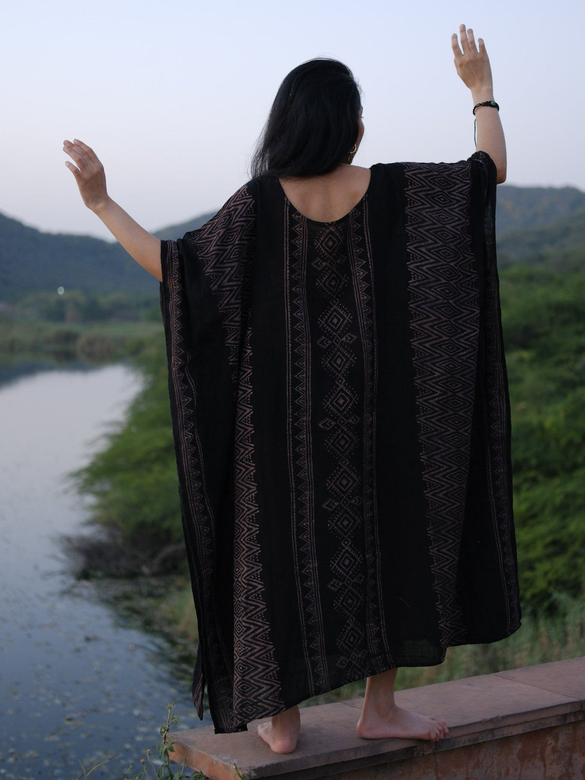 Back view of the Rooh Kaftan showing the softly curved back neckline and vertical print stripes