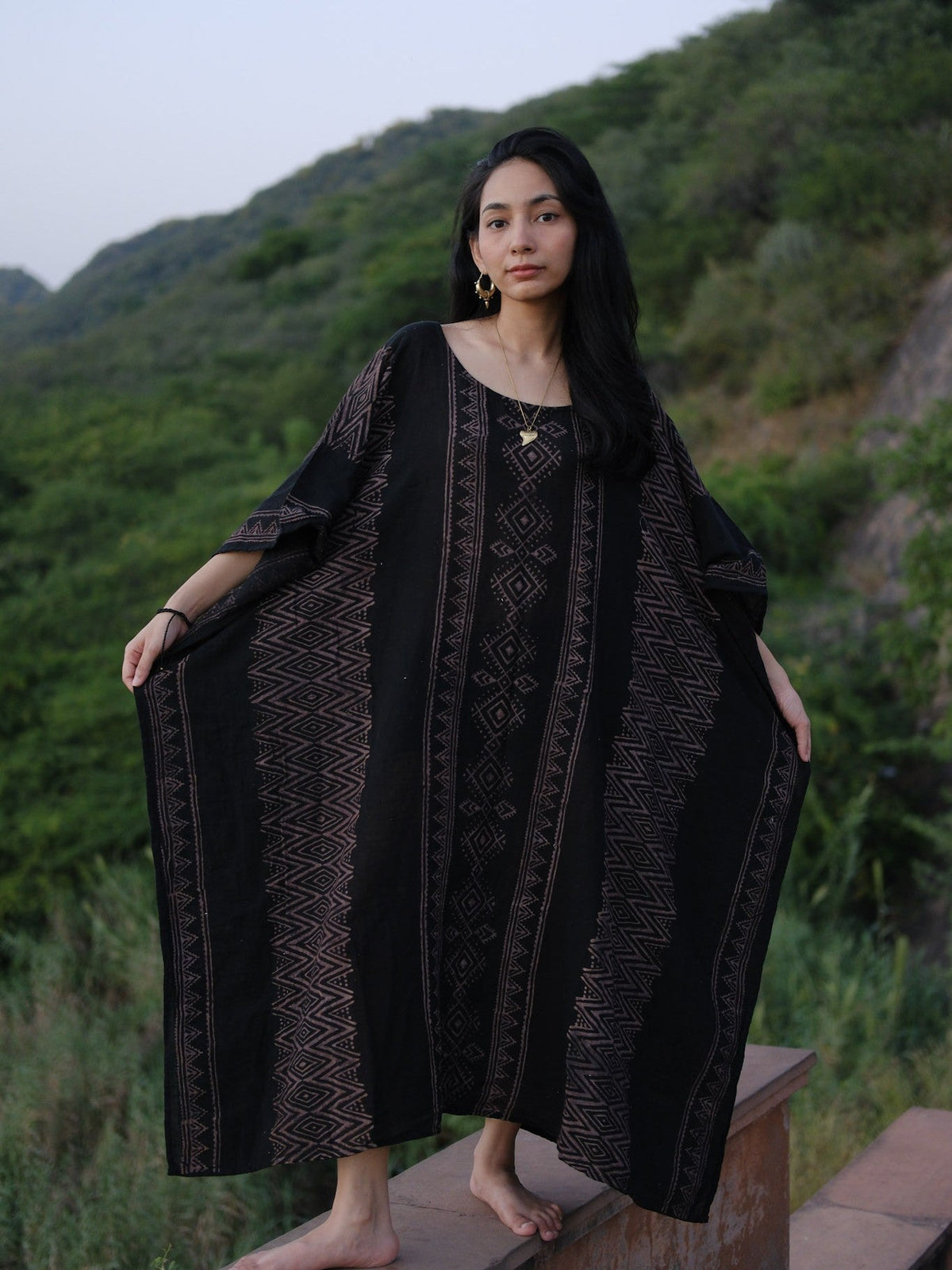 Rooh Kaftan in black khadi cotton with a mauve geometric print, front view on model