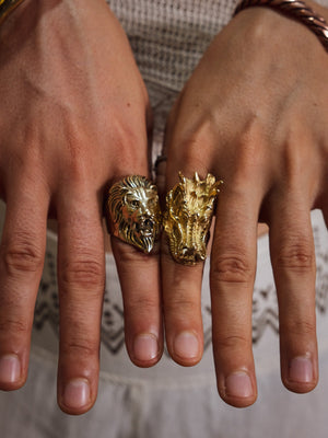 Singam brass lion head ring worn alongside a matching lion and dragon head ring pair, styled on both hands