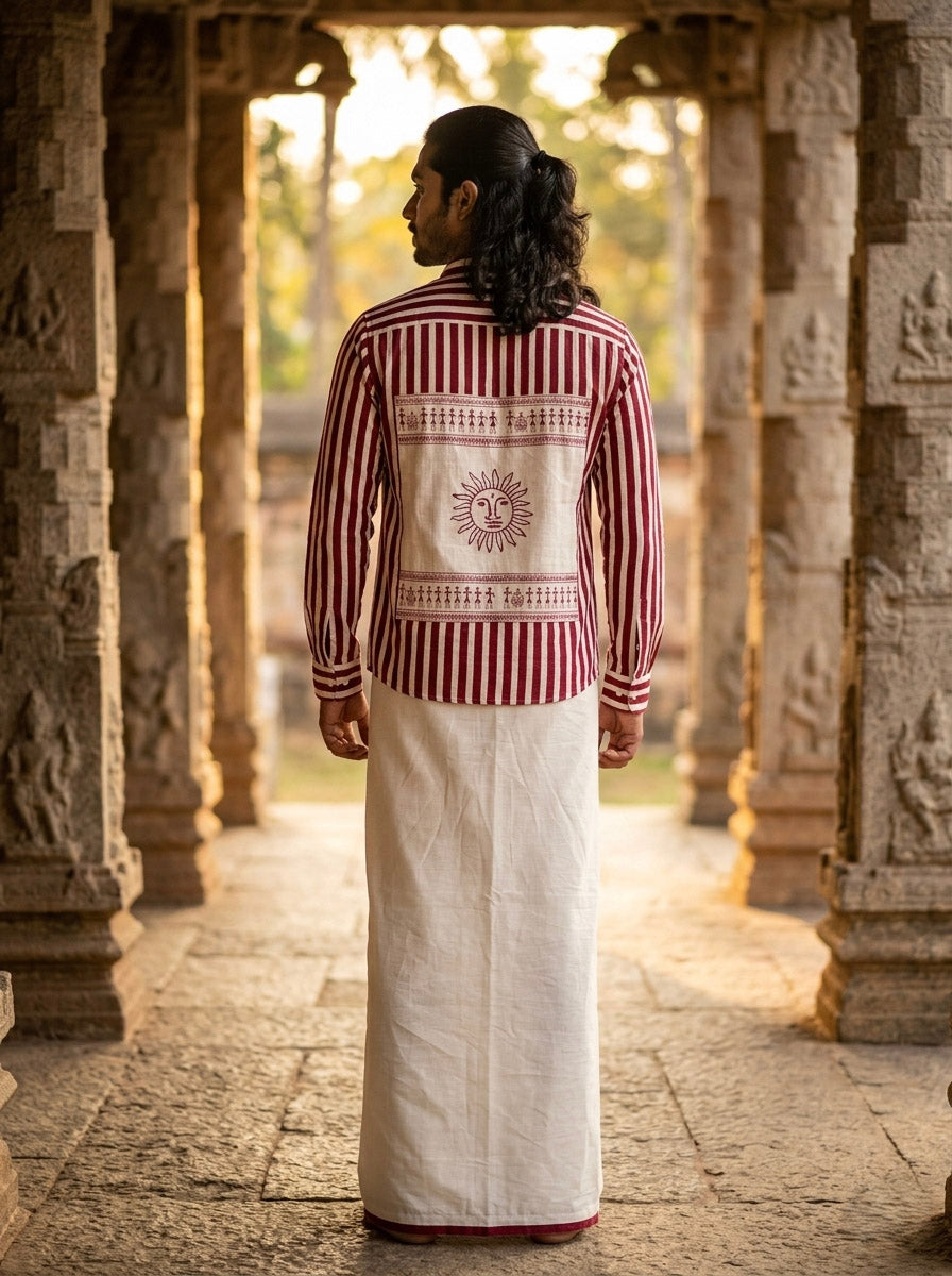 Back view of the Surya Rekha shirt showing the large embroidered sun panel framed by figure borders