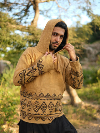 Sand yellow handblock hoodie, black tribal print at hem and sleeves, man on rocky trail