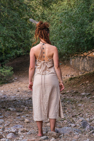 Back view of the Trishika beige khadi cotton maxi dress showing the button placket halter back and tie
