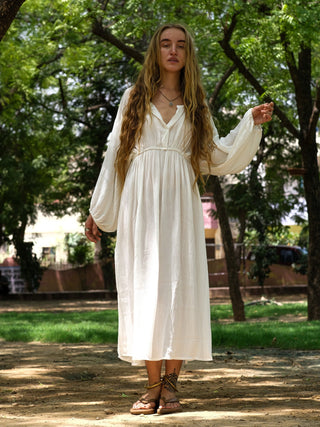 Ivory white boho maxi dress full-length front view in a park
